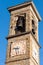 Old bell tower with watches in Bergamo town, Italy