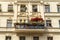 Old Berlin house with balcony and parasols