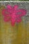 Old beton concrete wall with pink moth butterfly graffity. Urban art. Naive art. Fron view. Close-up