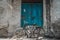 An old bicycle parked outside in front of an old vintage blue wooden- closed door of an old house in Jodhpur, Rajasthan, India.