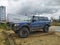 Old big 4WD off road car Toyota Landcruiser parked