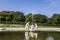 old big baroque fountain made of white marble. Beautiful fountain with antique sculptures in the park