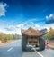 Old big tipper with ground on road in forest rear