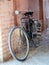 An old bike in a historical passage of Yazd , Iran