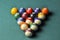 Old billiard balls composition on green pool table