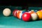 Old billiard balls on a green table. billiard balls isolated on a green background