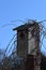 Old birdhouse against a clear blue sky