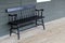 Old black bench on wood porch