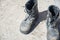 Old Black Leather army boots. Military boots of soldiers standing on the cement ground