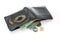 Old black leather wallet with money isolated.