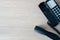 The old black phone on the business office desk in the wood be used for contact Connect, above on table top view Employees are