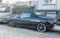 Old black small Italian popular private car Alfa Romeo Spider GTV