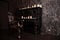 Old black vintage piano with white candles and retro chair. nobody