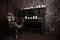 Old black vintage piano with white candles and retro chair. nobody