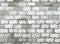 Old black and white concrete paving blocks shameless pattern background. Pavement texture.