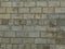 Old block wall with embossed texture