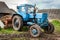 Old blue Belarus tractor on a ground