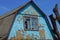 Old blue brown loft of a rural house with a window