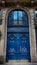 Old Blue carved ornate door in Paris, France.