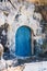 Old blue door in stone wall