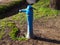 Old blue drinking fountain.