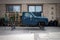 Old blue pickup truck in the process of restoration without wheels raised on trestles