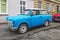 Old blue plastic cheap car Trabant 601 parked