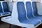 Old blue plastic seats in a suburban train in Moscow, Russia