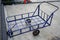 Old blue pull along wagon cart with 3 wheels for heavy duty park