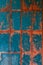 Old blue-red tile on the wall, rustic background