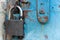 Old blue rustic door with rusty lock and keyhole