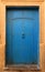 Old blue studded Moroccan riad door,