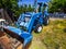 Old Blue Tractor With Front Scoop & Backhoe