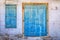 Old blue weathered door and window in Cyprus