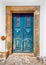 Old blue wooden door in rural house, Portugal