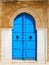 Old blue wooden door in tunisian arabic style