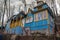 Old blue wooden mansion with rounded window