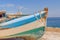 Old blue wooden shabby fishing boat