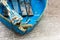 Old blue wooden shabby fishing boat detail