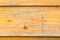 The old boards covered with a yellow varnish