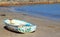 Old boat abandoned on a beach.