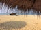 Old boat with fishing net on a sandy beach. India. Goa.