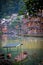 Old boat and historic wooden Diaojiao houses in Fenghuang