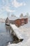 Old boat house, a bridge, snow and ice
