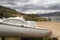 Old boat near to Colombian Guatavita`s tomine reservoir with sand ground