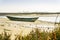 Old boat in Ria Formosa Natural Park in Faro, Algarve, Portugal