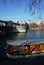 Old boat on Seine river, Bir-Hakeim bridge in autumn season sunny day blue sky real moment