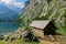 Old boathouse in scenic alpine landscape