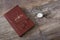 Old book, glasses and pocket watch on a textured table. Old fashioned still life