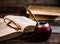 Old books, glasses, calabash, bombilla against the background of old wooden boards, conditions for a deep and pleasant reading.